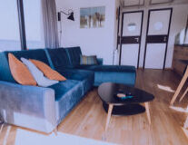 a living room filled with furniture and a blue chair